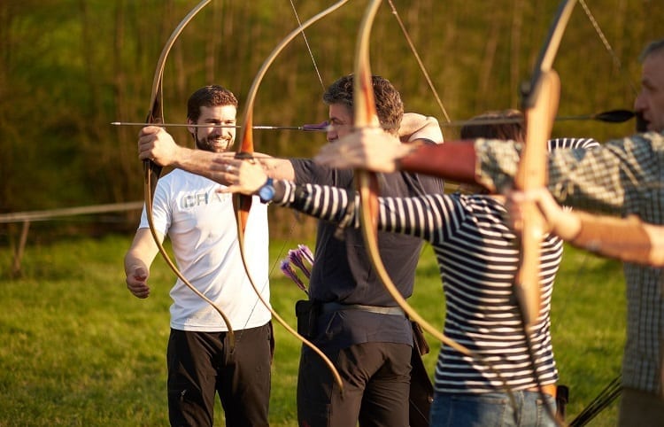 Group Of People On Archery Training