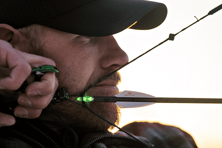 Man Shooting With Compound Bow